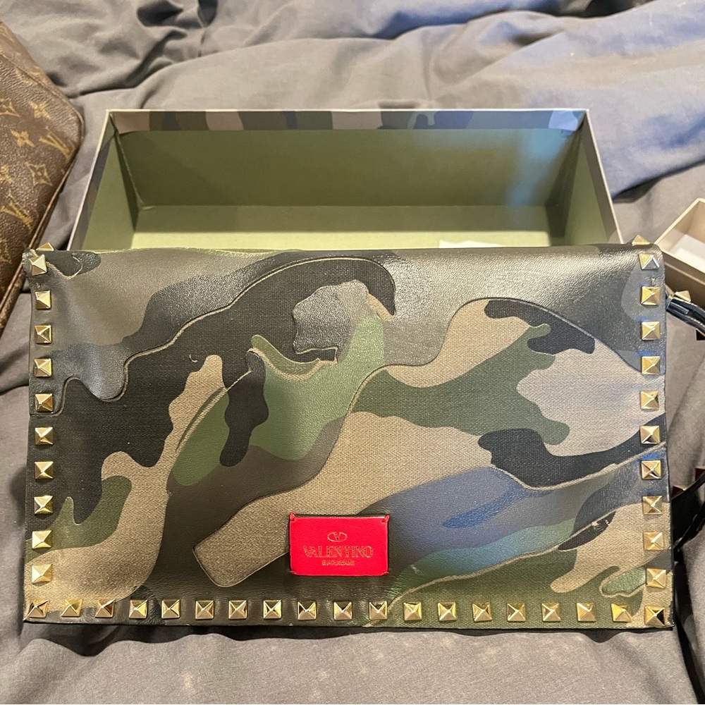 Pre-owned Valentino Rockstud camouflage clutch.   In great condition.